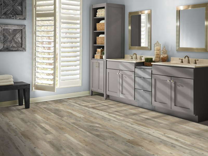 Light grey and brown Mohawk LVP floors provide style and durability for a modern bathroom.