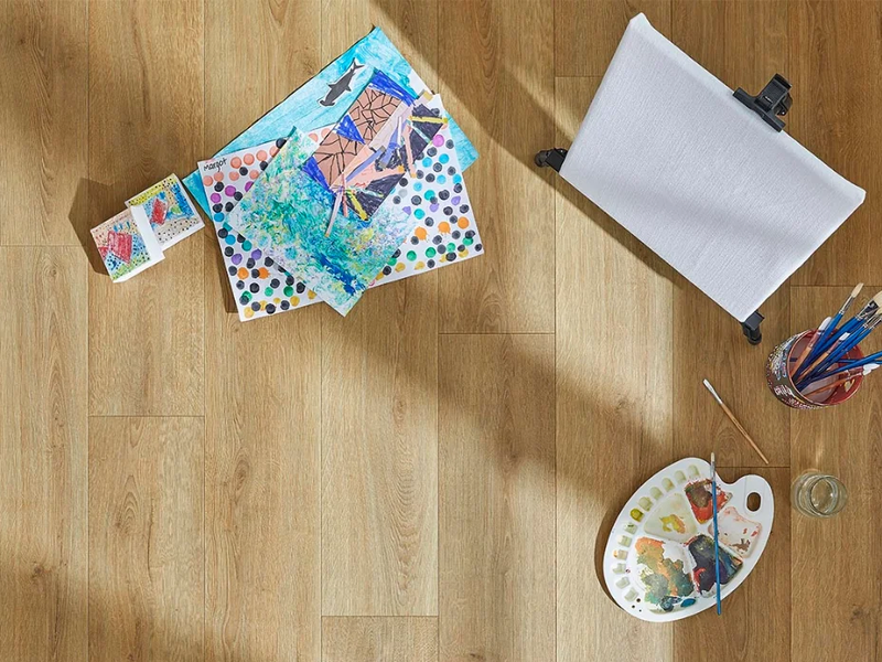 Art supplies on a laminate floor